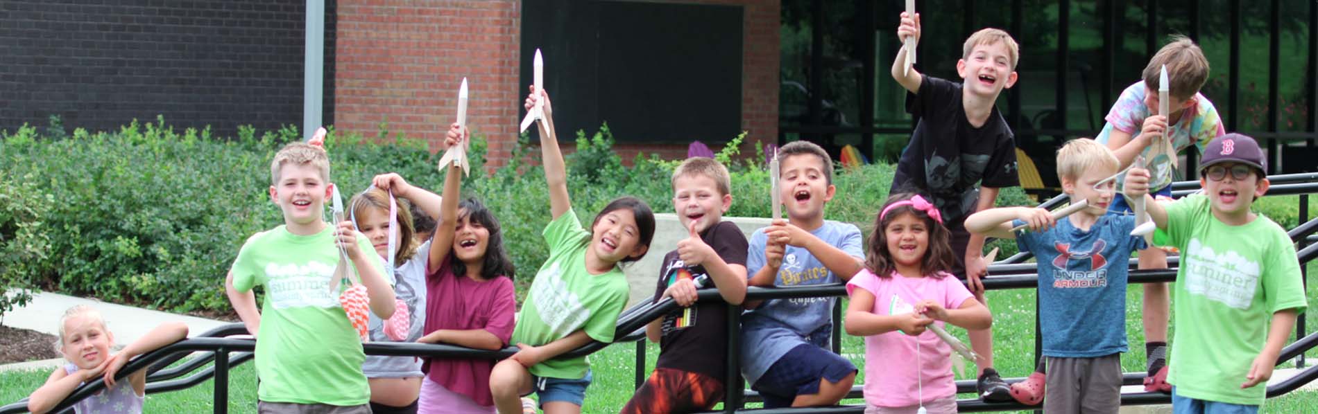 various children showing off their rockets