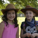 2 girls in cowboy hats
