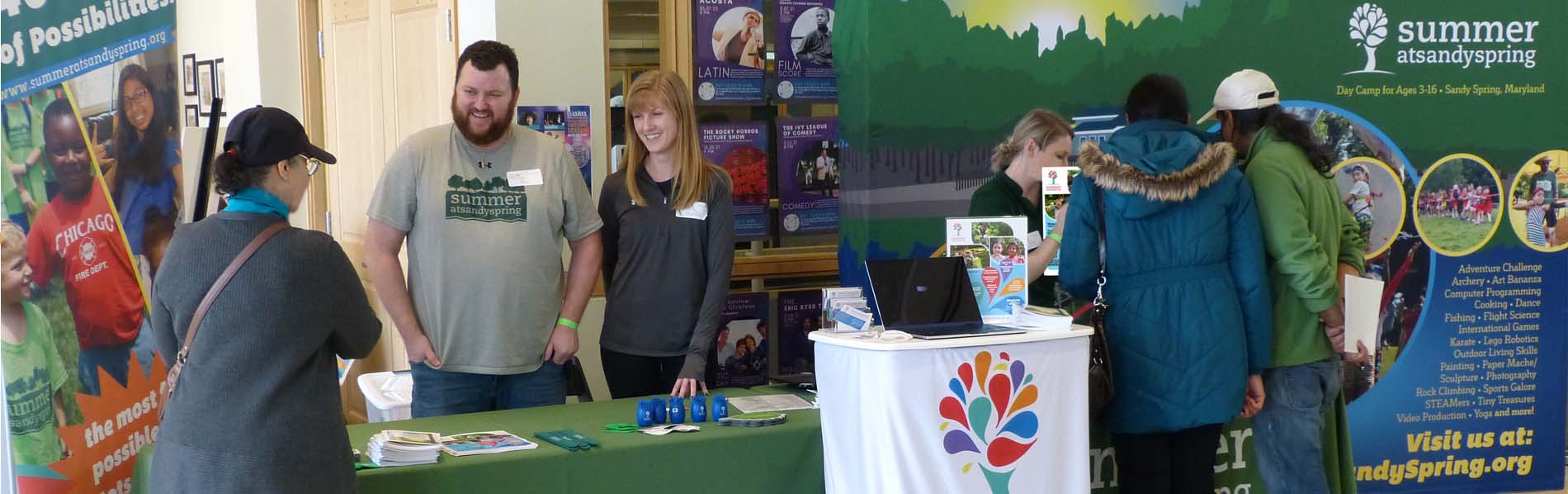 Camp staff showing visitors S@SS goodies